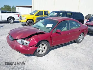 2003 Ford Taurus SES Standard with VIN 1FAFP55203G189473, listed as a IAAI auction lot 42013813 with 99,769 mi miles. Bid and sale history available at carsss.com. Image 2.