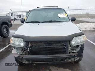 2006 Ford Escape XLT with VIN 1FMYU03126KC55897, listed as a IAAI auction lot 41733243 with 136,989 mi miles. Bid and sale history available at carsss.com. Image 12.