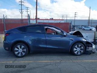 2023 Tesla Model Y Long Range with VIN 7SAYGDEE7PA192488, listed as a IAAI auction lot 42233466 with Not provided miles and . Bid and sale history available at DreamBid. Image 14.