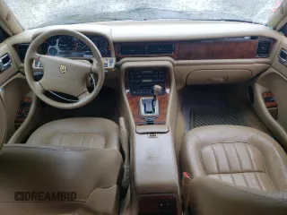1997 Jaguar XJ with VIN SAJHX6248VC806189, listed as a Copart auction lot 57891035 with 51,654 mi miles and Salvage title. Bid and sale history available at DreamBid. Image 8.