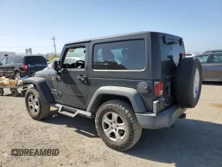 2017 Jeep Wrangler Willys Wheeler with VIN 1C4AJWAG6HL502148, listed as a Copart auction lot 56337435 with 183,552 mi miles and Clean title. Bid and sale history available at DreamBid. Image 2.