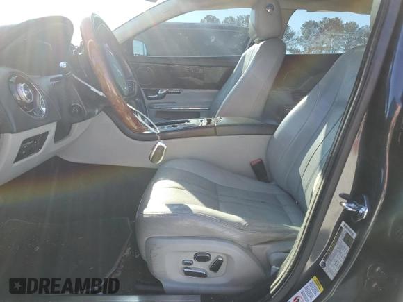 2012 Jaguar XJ with VIN SAJWA1CB1CLV31450, listed as a Copart auction lot 46883875 with 150,268 mi miles and Salvage Title. Bid and sale history available at DreamBid. Image 7.