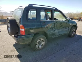 2000 Suzuki Vitara JX z VIN 2S3TD52V1Y6108459, wystawiony jako Copart lot #75526644 z przebiegiem 263 433 mil mil oraz Szkody całkowita. Historia ofert i sprzedaży dostępna na DreamBid. Obrazek 3.