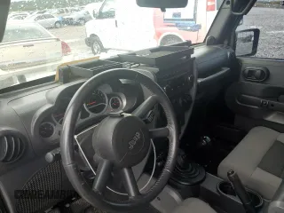 2010 Jeep Wrangler Rubicon with VIN 1J4BA6D14AL198524, listed as a Copart auction lot 65260235 with Not provided miles and Clean title. Bid and sale history available at DreamBid. Image 9.