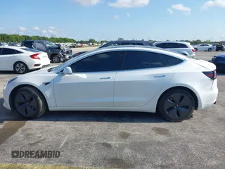 2020 Tesla Model 3 Standard Range Plus with VIN 5YJ3E1EA6LF799620, listed as a IAAI auction lot 42221643 with 55,458 mi miles and . Bid and sale history available at carsss.com. Image 13.
