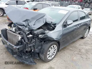 2021 Kia Forte LXS with VIN 3KPF24AD4ME266471, listed as a IAAI auction lot 41972334 with 54,346 mi miles and . Bid and sale history available at DreamBid. Image 2.