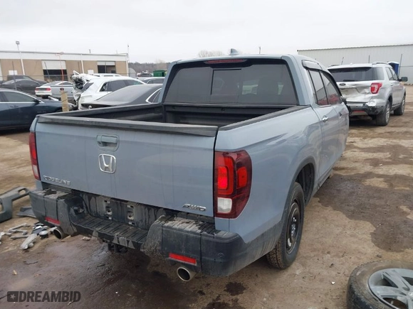 2023 Honda Ridgeline RTL-E with VIN 5FPYK3F70PB030718, listed as a IAAI auction lot 41667869 with 18,768 mi miles. Bid and sale history available at carsss.com. Image 4.