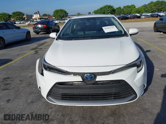 2024 Toyota Corolla Hybrid LE with VIN JTDBCMFE2RJ031865, listed as a IAAI auction lot 41602715 with 10,892 mi miles. Bid and sale history available at carsss.com. Image 12.