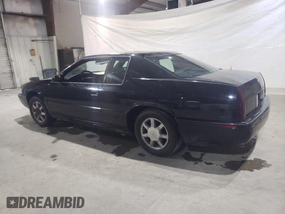 2000 Cadillac Eldorado Touring ETC z VIN 1G6ET1294YU144883, wystawiony jako Copart lot #80979854 z przebiegiem 89 271 mil mil oraz Czysty tytuł • Clean title. Historia ofert i sprzedaży dostępna na DreamBid. Obrazek 2.
