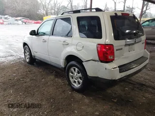 2008 Mazda Tribute ES with VIN 4F2CZ06148KM13459, listed as a IAAI auction lot 41742402 with 196,030 mi miles and . Bid and sale history available at DreamBid. Image 3.