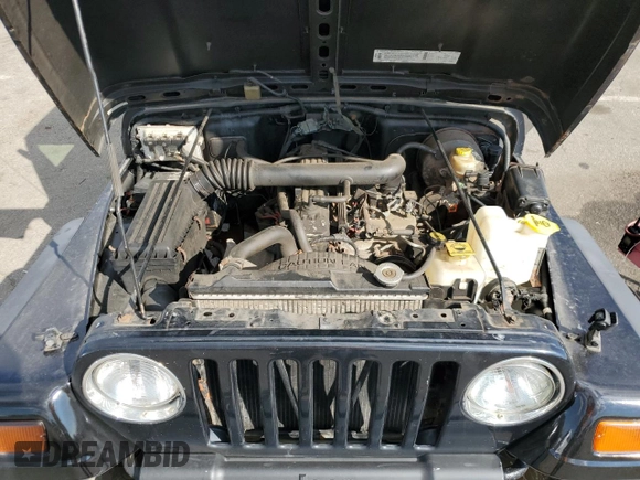 1999 Jeep Wrangler Sport z VIN 1J4FY19SXXP465037, wystawiony jako Copart lot #54772405 z przebiegiem 50 942 mil mil oraz Nie do naprawy • Non repairable. Historia ofert i sprzedaży dostępna na DreamBid. Obrazek 11.