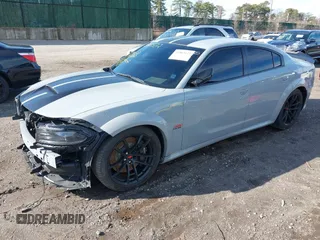 2022 Dodge Charger Scat Pack Widebody with VIN 2C3CDXGJ6NH176650, listed as a IAAI auction lot 41863122 with 34,569 mi miles and . Bid and sale history available at DreamBid. Image 2.