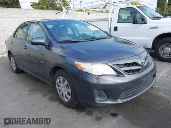 2011 Toyota Corolla L with VIN JTDBU4EE7B9162022, listed as a IAAI auction lot 42066643 with 124,384 mi miles. Bid and sale history available at carsss.com. Image 1.