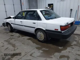 1990 Toyota Camry z VIN JT2SV21E5L3398379, wystawiony jako IAAI lot #41699413 z przebiegiem 100 136 mil mil oraz . Historia ofert i sprzedaży dostępna na DreamBid. Obrazek 3.