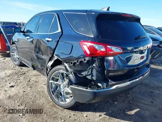 2020 Chevrolet Equinox LT with VIN 3GNAXKEV8LS679097, listed as a IAAI auction lot 41453201 with 59,105 mi miles and . Bid and sale history available at carsss.com. Image 3.
