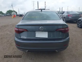 2021 Volkswagen Jetta SEL Premium z VIN 3VWG57BU8MM017203, wystawiony jako IAAI lot #42263741 z przebiegiem 26 556 mil mil oraz . Historia ofert i sprzedaży dostępna na DreamBid. Obrazek 16.