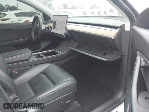 2021 Tesla Model Y Long Range with VIN 5YJYGAEE2MF260142, listed as a IAAI auction lot 41808666 with 87,316 mi miles and . Bid and sale history available at DreamBid. Image 5.
