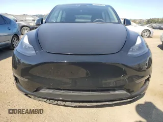 2022 Tesla Model Y Performance with VIN 7SAYGDEF1NF486218, listed as a Copart auction lot 63127435 with 99,302 mi miles and Salvage title. Bid and sale history available at DreamBid. Image 5.