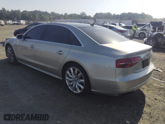 2017 Audi A8 with VIN WAU44AFD3HN014802, listed as a IAAI auction lot 42573537 with 121,096 mi miles and . Bid and sale history available at DreamBid. Image 3.