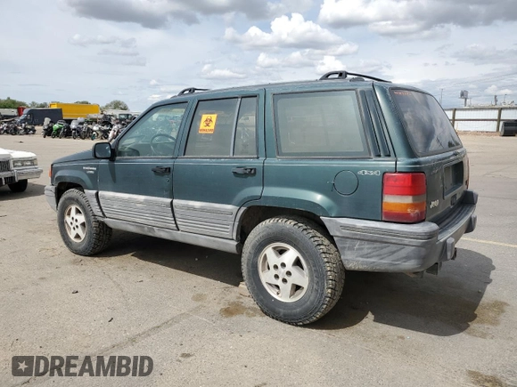 1993 Jeep Grand Cherokee Laredo with VIN 1J4GZ58Y8PC513026, listed as a Copart auction lot 57001465 with 135,242 mi miles and Clean title. Bid and sale history available at DreamBid. Image 2.