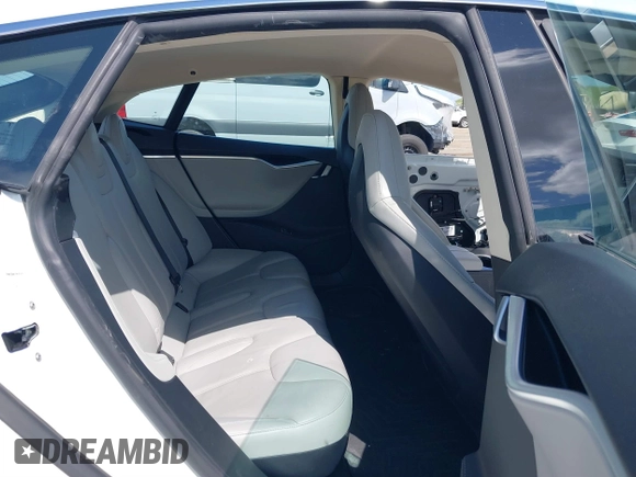 2014 Tesla Model S 60 with VIN 5YJSA1H10EFP56526, listed as a IAAI auction lot 41871784 with 143,361 mi miles and . Bid and sale history available at DreamBid. Image 8.
