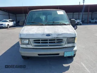 1999 Ford Econoline Cargo with VIN 1FTRE1428XHA20390, listed as a IAAI auction lot 41806875 with 207,954 mi miles. Bid and sale history available at carsss.com. Image 6.