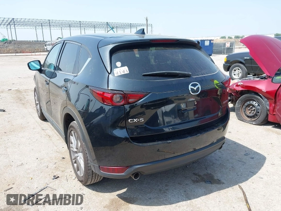 2020 Mazda CX-5 Grand Touring with VIN JM3KFADM1L0781634, listed as a IAAI auction lot 42333769 with 103,080 mi miles and . Bid and sale history available at DreamBid. Image 3.