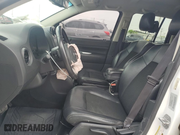 2016 Jeep Compass Latitude with VIN 1C4NJCEA4GD614932, listed as a Copart auction lot 60508845 with 144,833 mi miles and Salvage title. Bid and sale history available at DreamBid. Image 7.