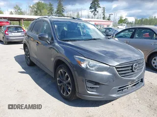 2016 Mazda CX-5 Grand Touring with VIN JM3KE4DY1G0793392, listed as a IAAI auction lot 42256948 with 81,131 mi miles and . Bid and sale history available at DreamBid. Image 1.