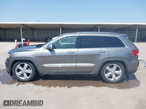 2013 Jeep Grand Cherokee Overland with VIN 1C4RJFCG2DC611877, listed as a IAAI auction lot 41910800 with 151,457 mi miles. Bid and sale history available at carsss.com. Image 14.