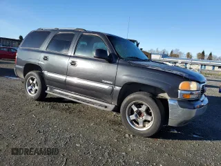 2004 GMC Yukon SLE with VIN 1GKEC13V64J281770, listed as a Copart auction lot 86830574 with 248,986 mi miles and Clean Title. Bid and sale history available at carsss.com. Image 4.