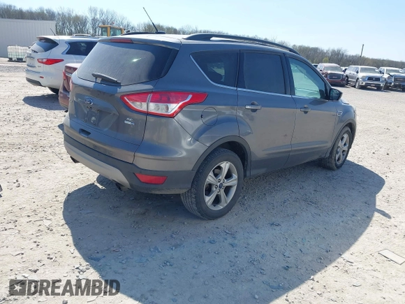 2014 Ford Escape SE with VIN 1FMCU9GX0EUC75145, listed as a IAAI auction lot 42048519 with 186,670 mi miles and . Bid and sale history available at DreamBid. Image 4.
