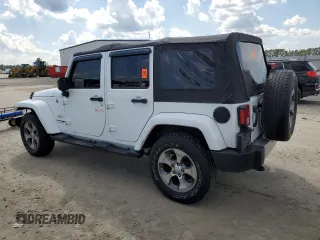 2018 Jeep Wrangler JK Unlimited Sahara with VIN 1C4HJWEG2JL922021, listed as a Copart auction lot 67796004 with 82,056 mi miles and Salvage Title. Bid and sale history available at carsss.com. Image 2.
