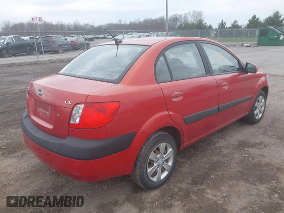 2009 Kia Rio SX with VIN KNADE223996556806, listed as a IAAI auction lot 42117938 with 54,007 mi miles. Bid and sale history available at carsss.com. Image 4.