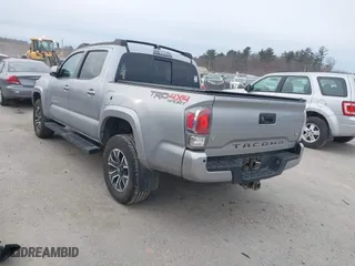 2020 Toyota Tacoma 4WD SR5 with VIN 3TMCZ5AN6LM306311, listed as a IAAI auction lot 41220025 with 67,806 mi miles. Bid and sale history available at carsss.com. Image 3.