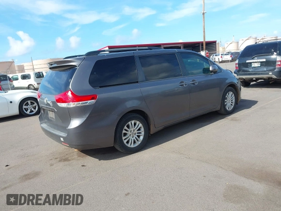 2014 Toyota Sienna XLE with VIN 5TDYK3DC2ES438980, listed as a IAAI auction lot 42067750 with 143,728 mi miles and . Bid and sale history available at DreamBid. Image 4.