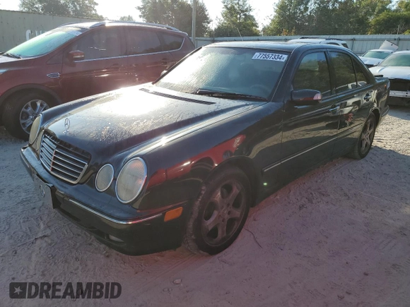 2002 Mercedes-Benz E-Class with VIN WDBJF65J32B494321, listed as a Copart auction lot 77557334 with 198,820 mi miles and Salvage Title. Bid and sale history available at carsss.com. Image 1.