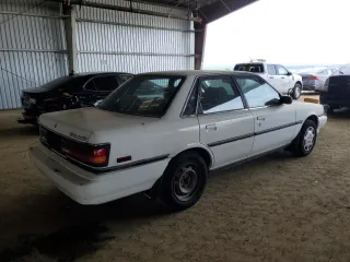 1991 Toyota Camry DLX z VIN 4T1SV21E1MU450315, wystawiony jako Copart lot #42772935 z przebiegiem 125 494 mil mil oraz Szkoda całkowita • Salvage title. Historia ofert i sprzedaży dostępna na DreamBid. Obrazek 3.