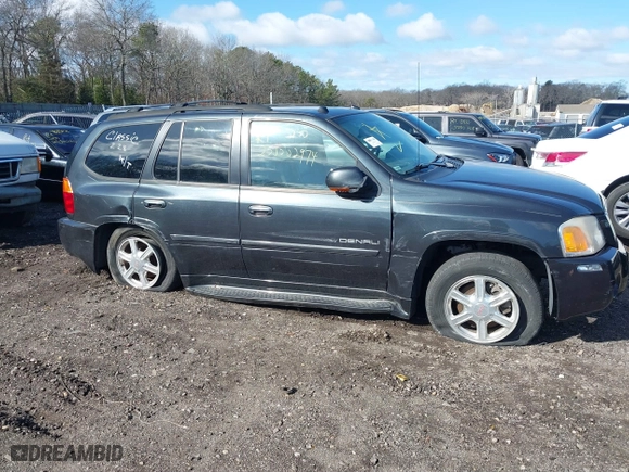 2005 GMC Envoy Denali with VIN 1GKET63M052336214, listed as a IAAI auction lot 41852417 with 999,999 mi miles. Bid and sale history available at carsss.com. Image 6.