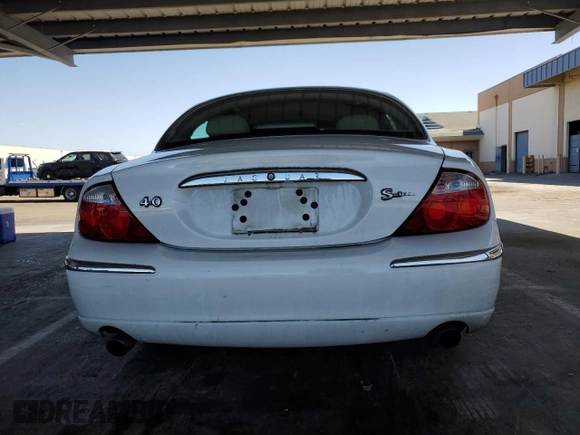 2000 Jaguar S-Type V8 z VIN SAJDA01D7YGL39410, wystawiony jako Copart lot #56814185 z przebiegiem 47 861 mil mil oraz Szkoda całkowita • Salvage title. Historia ofert i sprzedaży dostępna na DreamBid. Obrazek 6.