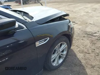 2013 Ford Taurus SEL with VIN 1FAHP2E84DG188503, listed as a IAAI auction lot 41800277 with 215,015 mi miles. Bid and sale history available at carsss.com. Image 6.