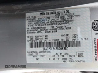 2011 Ford Fusion Hybrid z VIN 3FADP0L34BR208880, wystawiony jako IAAI lot #42432914 z przebiegiem 75 621 mil mil oraz . Historia ofert i sprzedaży dostępna na DreamBid. Obrazek 9.