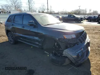 2018 Jeep Grand Cherokee High Altitude with VIN 1C4RJFCG3JC488022, listed as a Copart auction lot 87700385 with 94,390 mi miles and Salvage title. Bid and sale history available at DreamBid. Image 4.