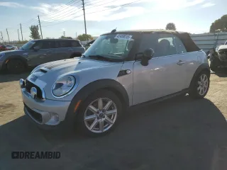 2013 MINI Convertible S with VIN WMWZP3C50DT550800, listed as a Copart auction lot 42409015 with 101,421 mi miles and Salvage Title. Bid and sale history available at DreamBid. Image 1.