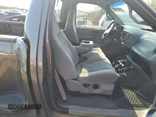 2002 Ford F-150 XL с VIN 1FTRF07202KA56864, выставлен на аукционе Copart как лот 71640724 с пробегом 165 654 миль миль и Списание • Salvage title. История ставок и продаж доступна на DreamBid. Изображение 10.