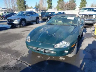 1999 Jaguar XK8 with VIN SAJGX2049XC039317, listed as a IAAI auction lot 41334429 with 1 miles. Bid and sale history available at carsss.com. Image 6.
