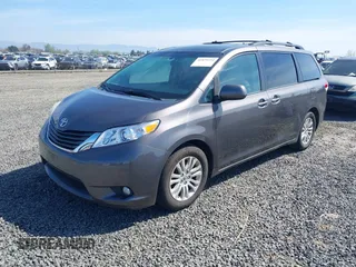 2014 Toyota Sienna XLE with VIN 5TDYK3DC5ES451965, listed as a IAAI auction lot 41879334 with 145,114 mi miles and . Bid and sale history available at DreamBid. Image 2.