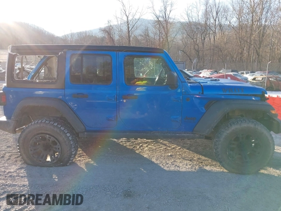 2021 Jeep Wrangler Unlimited Sport S with VIN 1C4HJXDN4MW779291, listed as a IAAI auction lot 41290109 with 43,379 mi miles and . Bid and sale history available at DreamBid. Image 13.