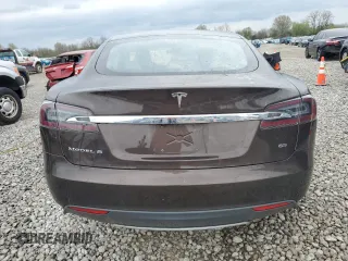 2014 Tesla Model S 60 with VIN 5YJSA1H19EFP51003, listed as a Copart auction lot 52164335 with 105,926 mi miles and Salvage Title. Bid and sale history available at DreamBid. Image 6.