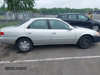 2001 Toyota Camry CE z VIN 4T1BG22K41U847401, wystawiony jako IAAI lot #42275762 z przebiegiem 202 936 mil mil oraz . Historia ofert i sprzedaży dostępna na DreamBid. Obrazek 13.